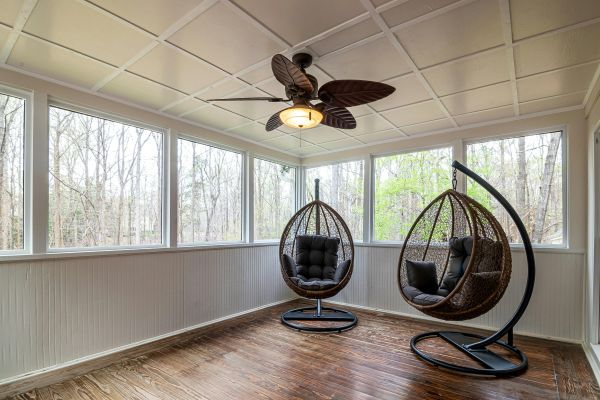 Ceiling Fan and Egg Chairs inside a Room