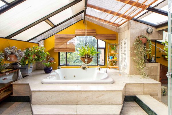 White Tub Surrounded With Green Plants