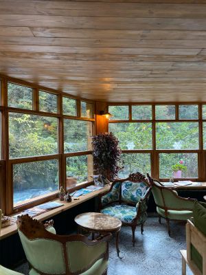 Brown Wooden Table and Chairs Near Window